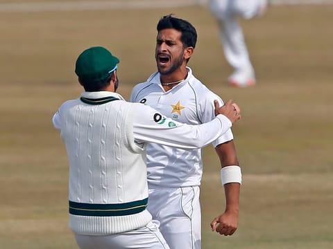 Pakistan's Hasan Ali, right, celebrates with teammates after taking the wicket of South Africa's Aiden Markram during the fifth day of the second Test at the Pindi Stadium in Rawalpindi. 