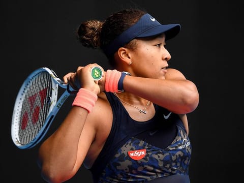 Japan's Naomi Osaka hits a return against Russia's Anastasia Pavlyuchenkova during their Australian Open tennis tournament in Melbourne on February 8, 2021. 