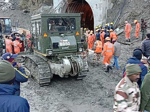 This handout photo taken on February 8, 2021 and released by the Indo-Tibetan Border Police (ITBP) shows members of the Indo-Tibetan Border Police (ITBP) during a rescue operation after a broken glacier caused a major river surge that swept away bridges and roads, at a tunnel near Tapovan dam in Chamoli district of Uttarakhand. 