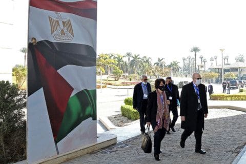 This handout image provided by Egypt's State Information Service (SIS) on February 8, 2021 shows Saleh Abdel Ahad (R), representative of the Democratic Front for the Liberation of Palestine, arriving to attend the Palestinian National Dialogue hosted by Egypt's General Intelligence Service in the capital Cairo. 