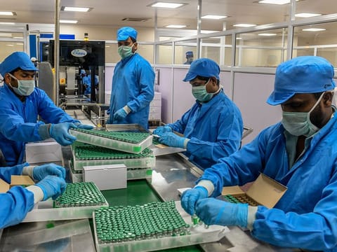 Workers packing the Covishield coronavirus vaccine at the Serum Institute of India in Pune. 
