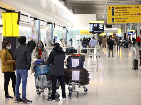 Travellers walk through Terminal 2 at Heathrow Airport. The UK has set a tentative date of May 17 to relaunch international travel.