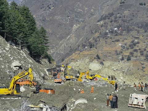 ITBP personnel carry out rescue and restoration work at Raini village, in Chamoli district of Uttarakhand. 