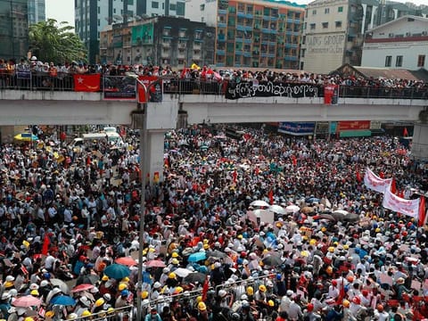 Anti-coup protesters gather at an intersection in downtown Yangon, Myanmar Monday, Feb. 22, 2021.