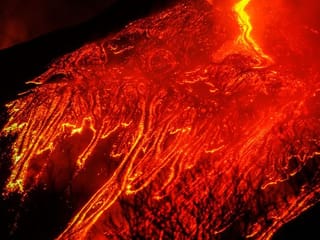 Photos: Spectacular eruptions from Italy's Mount Etna light up night sky