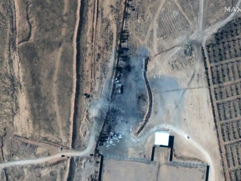 This handout satellite image taken and released by Maxar Technologies on February 26, 2021 shows the aftermath of recent US airstrikes on a small group of buildings at an unofficial crossing at the Syria-Iraq border near Alm Qaim, Iraq. Syria and Iran on February 26 condemned a deadly US air strike on Iranian-backed militias with Damascus calling it a "bad sign" from the new Biden administration and Tehran saying it would further destabilise the region. 
