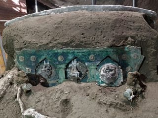 Photos: Archaeologists uncover ancient ceremonial carriage near Pompeii