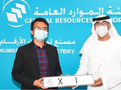  Xian Jun Xu receives his special number plate.