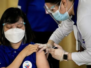 Photos: 'Light' after darkness as Philippines COVID-19 vaccinations begin