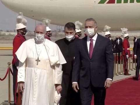 Pope Francis arrives at Baghdad International Airport where a welcoming ceremony is held to start his historic tour in Baghdad, Iraq, March 5, 2021, in this screen grab taken from video. 