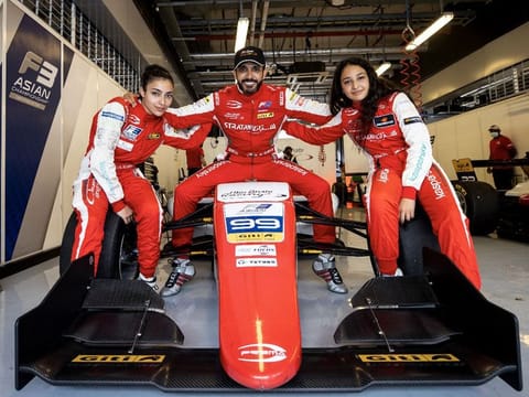 Khaled Al Qubaisi with his daughters Amna and Hamda