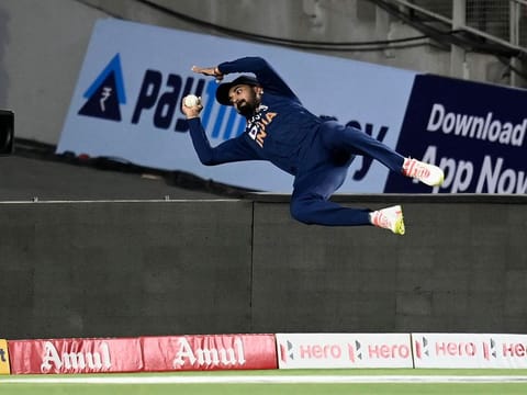 India's KL Rahul unsuccessfully tries to catch the ball to dismiss England's Jos Buttler (not pictured) during the first Twenty20 international cricket match between India and England at the Narendra Modi Stadium in Motera on March 12, 2021.