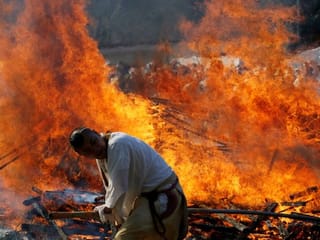 Photos: Japanese worshippers brave smouldering coals to pray for safety