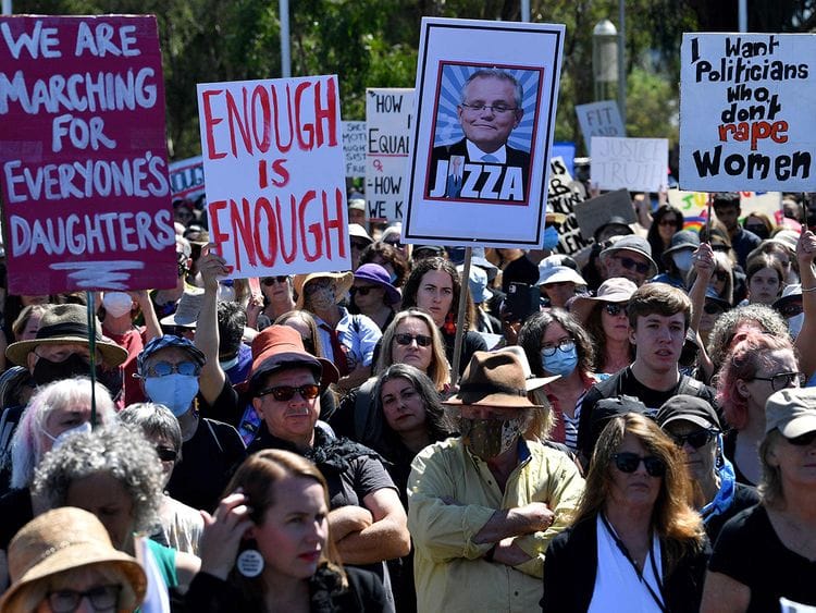Protesters attend a rally against sexual violence