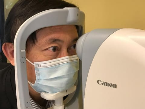 Benny Zee, a scientist from the Chinese University of Hong Kong, demonstrates retinal eye scanning technology used for early detection of autism in Hong Kong, China.