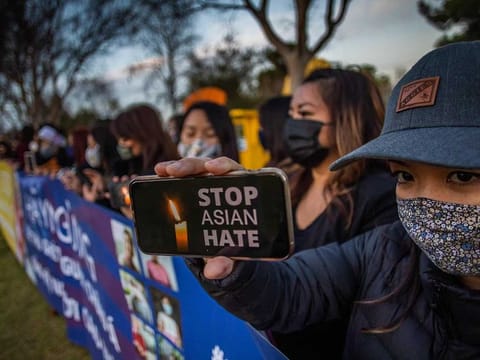 A candlelight vigil in Garden Grove, California, on March 17, 2021 to unite against the spate of violence targetting Asians and to express grief and outrage after yesterday's shooting that left eight people dead in Atlanta, Georgia, including at least six Asian women. 