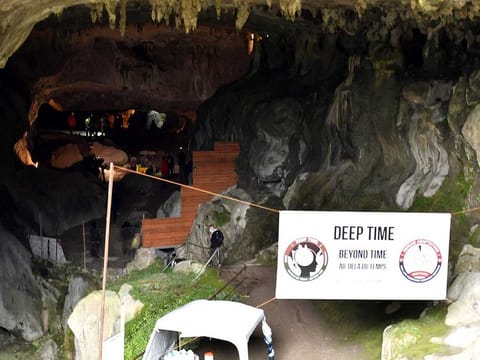 A picture taken on March 14, 2021 shows a banner bearing the title of the project at the entrance of the Lombrives cave in Ussat, where a Swiss-French explorer-researcher and 14 volunteers are about to spend 40 days as part of a scientific experiment. Almost a year after the first lockdown in France, Christian Clot and 14 volunteers aged between 27 and 50 will live from March 14, 2021 in the Lombrives cave in Ariege for 40 days without seeing the light of day or having notion of time. 