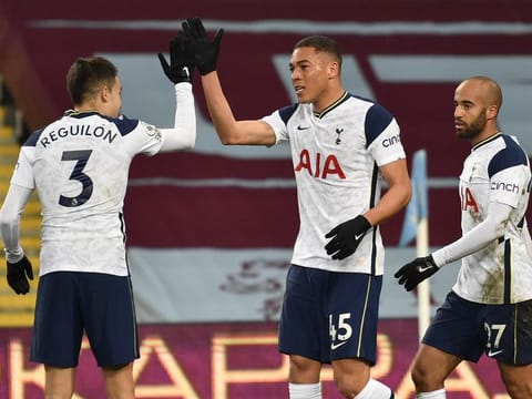 Tottenham's Carlos Vinicius, centre, is congratulated by teammate Sergio Reguilon.