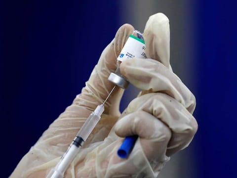 A paramedic prepares a dose of Sinopharm's coronavirus disease (COVID-19) vaccine before administering it to a resident, at a vaccination centre in Karachi, Pakistan March 22, 2021.