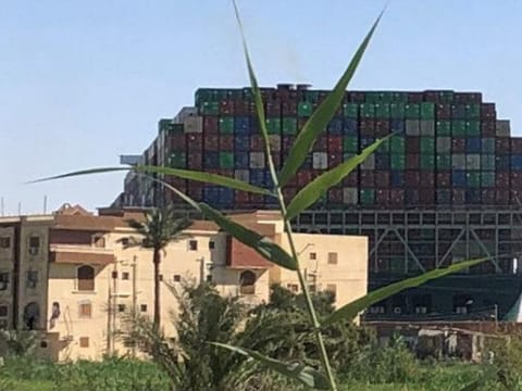Stranded container ship Ever Given, one of the world's largest container ships, is seen after it ran aground, in Suez Canal, Egypt.