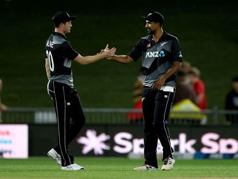 New Zealand's Ish Sodhi celebrates the team's victory over Bangladesh with teammate Adam Milne 