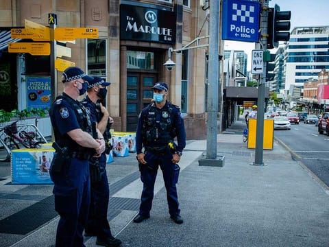 Police officers patrol the Valley Mall in Brisbane on March 29, 2021 as more than two million people in the city entered a three-day lockdown after a cluster of coronavirus cases was detected in Australia's third-biggest city. 