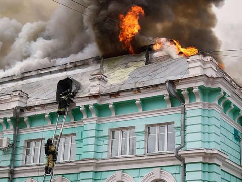 Firefighters extinguish a fire that broke out at a cardiac surgery centre in Blagoveshchensk, in Russia's Far East, on April 2, 2021.