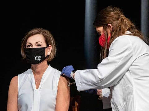  In this March 3, 2021, file photo, Iowa Governor Kim Reynolds gets the Johnson & Johnson COVID-19 vaccine during a news conference at Iowa PBS in Johnston, Iowa.