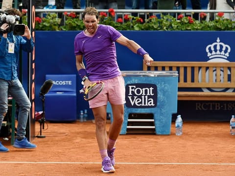 Rafael Nadal celebrates defeating Japan's Kei Nishikori during their Barcelona Open clash