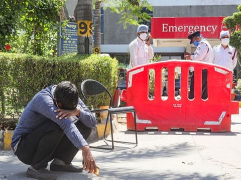 A man breaks down after loosing his relative at Jaipur Golden hospital, Rohini, New Delhi.