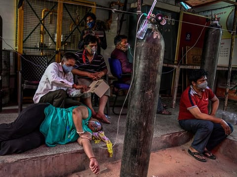COVID-19 patients receive oxygen at a Sikh gurdwara in Delhi, Sunday, April 25, 2021. 