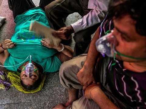 COVID-19 patients receive oxygen at a Sikh gurdwara in Delhi, Sunday, April 25, 2021. As a second wave of the pandemic rages in India, the aid coming from around the globe is unlikely to plug enough holes in India’s sinking health care sector to fully stop the deadly crisis