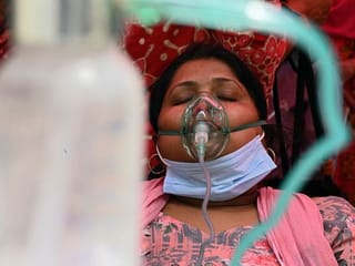 Photos: Lifesaving oxygen aid arrives in India as COVID-19 death toll hits new record