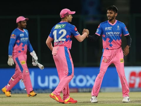 Players shake hands after the match.