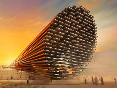An artistic rendering of the UK Pavilion facade featuring the LED message composed by AI at Expo 2020 Dubai.