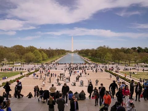 People on the National Mall in Washington, April 3, 2021. Daily vaccination rates are slipping and there is growing consensus among scientists and public health experts that while herd immunity may never be possible, the virus will most likely become a manageable threat that will continue to circulate, causing hospitalisations and deaths but in much smaller numbers.