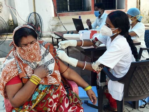A medic administers a COVID-19 vaccine to a beneficiary at a government dispensary, during the second wave of the coronavirus pandemic, in Patna on Sunday, May 2, 2021. 