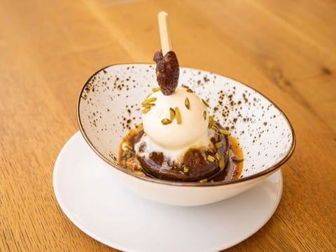 Date pudding with hot caramel sauce and vanilla ice cream