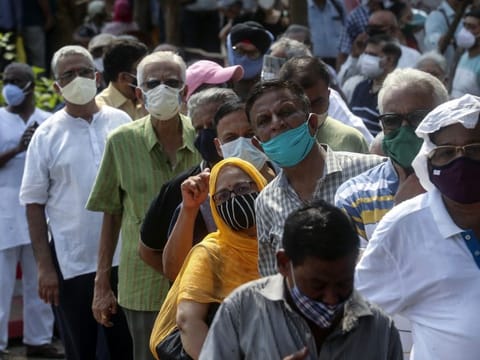 People queue up for COVID-19 vaccine at a vaccination centre in Mumbai late last month.