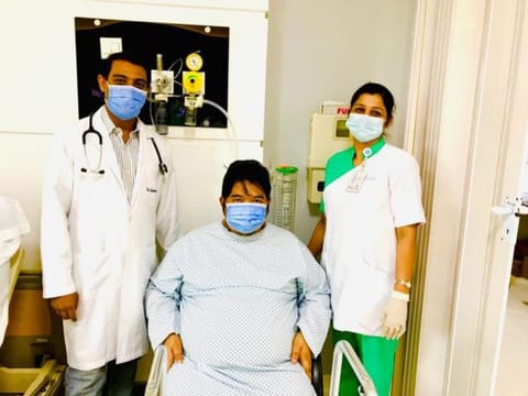 Filipino expatriate Melvin Cabile Masule with his care-givers at NMC Specialty Hospital in Dubai. 