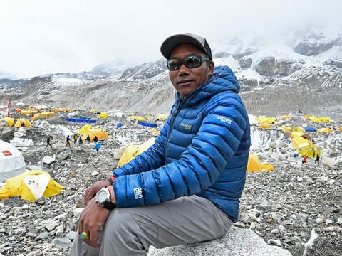 In this photograph taken on May 2, 2021, Nepal's mountaineer Kami Rita Sherpa poses for a picture during an interview with AFP at the Everest base camp in the Mount Everest region of Solukhumbu district, as Sherpa on May 7 reached the summit of Mount Everest for the 25th time, breaking his own record for most summits of the highest mountain in the world. 
