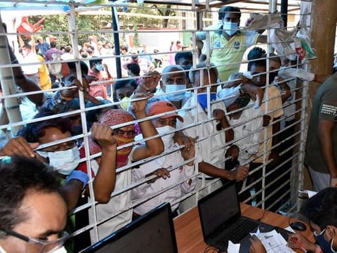 Beneficiaries gather at a COVID-19 vaccine centre during the third phase of the countrywide inoculation drive, in Patna on Monday, May 10, 2021. 