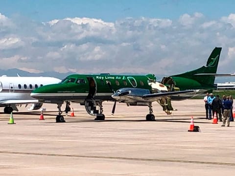 This image from CBS Denver shows a Key Lime Air Metroliner that landed safely at Centennial Airport after a mid-air collision near Denver on Wednesday, May 12, 2021. 
