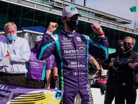 Romain Grosjean celebrates after winning the pole at Indianapolis Motor Speedway