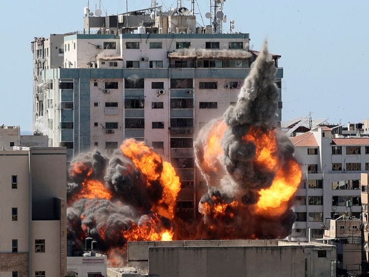 A ball of fire erupts from a building housing various international media, including The Associated Press, after an Israeli airstrike on Saturday, May 15, 2021 in Gaza City. The attack came roughly an hour after the Israeli military ordered people to evacuate the building, which also housed Al-Jazeera and a number of offices and apartments. There was no immediate explanation for why the building was targeted.