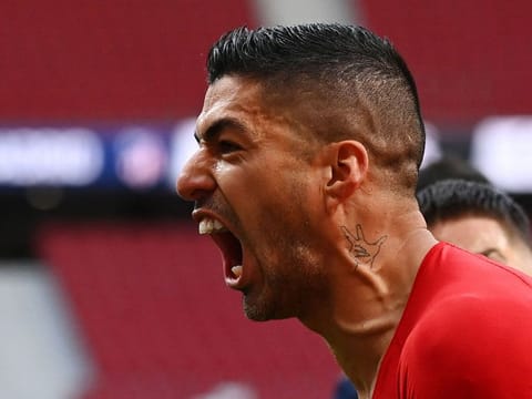 Atletico Madrid’s Luis Suarez celebrates his winning goal.
