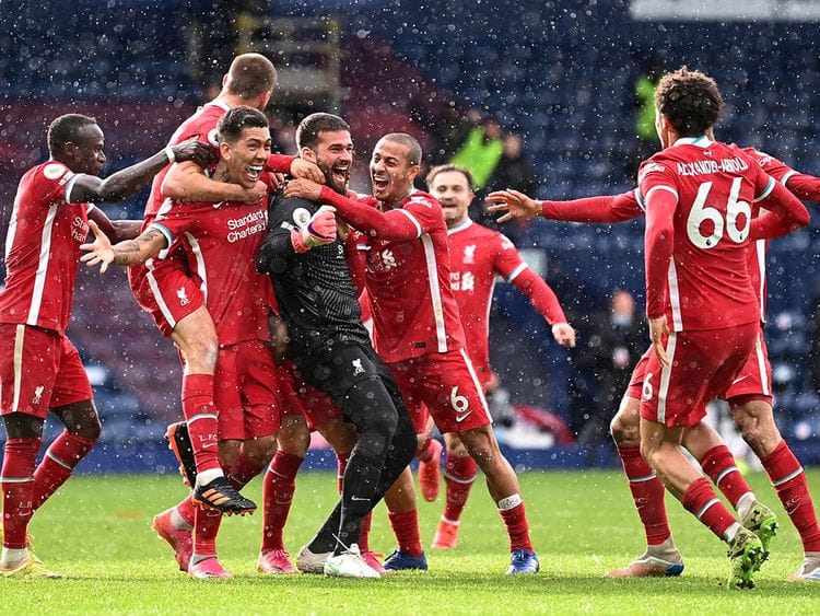 Liverpool's Alisson celebrates scoring the winner at West Brom