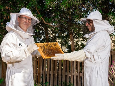 César Habib (left), Regional Director Middle East & Africa, Rolls-Royce Motor Cars, and Ayhan Olcer, CEO, AGMC, launch the apiary in Dubai.