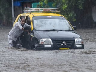 Photos: Heavy rains lash Mumbai; train, traffic services hit