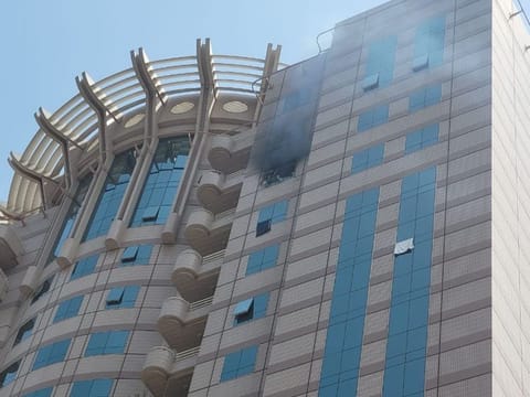 Smoke billowing from the apartment in Al Riqqa, Dubai, where a fire broke out on Wednesday morning.
